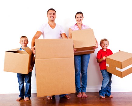 Packed moving boxes and furniture ready for transport in Bayswater