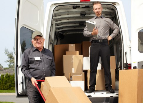 Packed boxes and furniture ready for a Bayswater relocation van