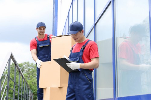 Team handling business furniture and equipment during a local move