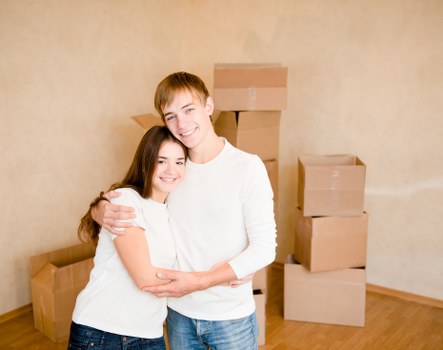 Courier handling furniture delivery with careful loading procedures