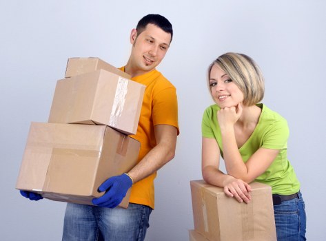 Packed boxes and furniture prepared for a flat move in Bayswater