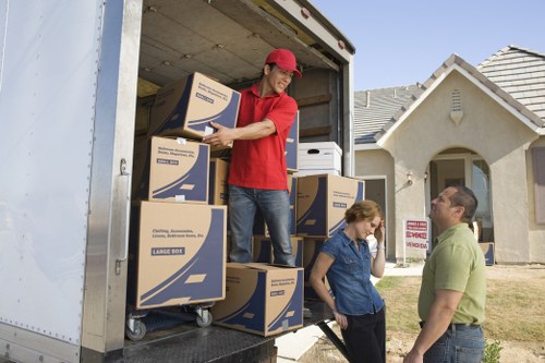 Packed moving boxes and furniture ready for transport