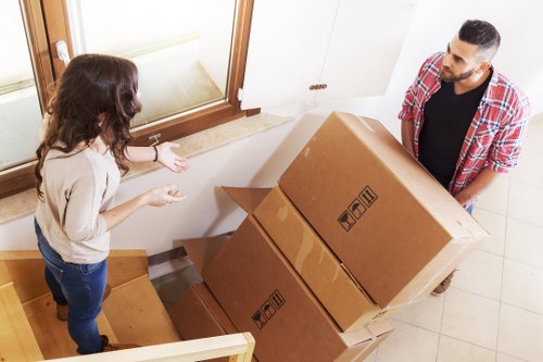 Removalists loading furniture carefully for a house move in Bayswater