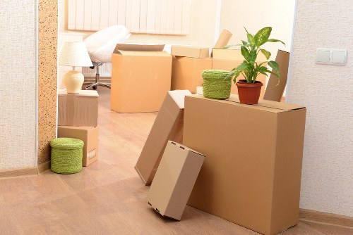 Office furniture and equipment being moved through a Bayswater building